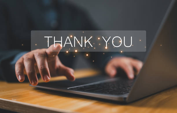 istock businessman using a laptop and touching the message thank you on a display screen. concept of thank you business, congratulations, and appreciation gratitude. presentation from technology digital 2163710428