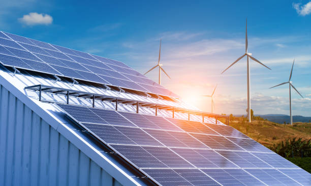 istock Solar panels and wind turbines under blue sky background. 2163710753