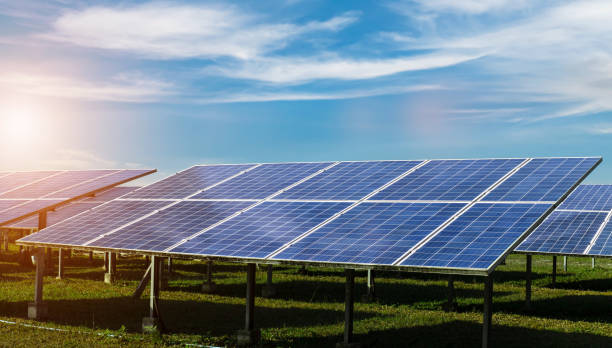 istock solar panels against blue sky background. Photovoltaic, alternative electricity source concept. 2163710778