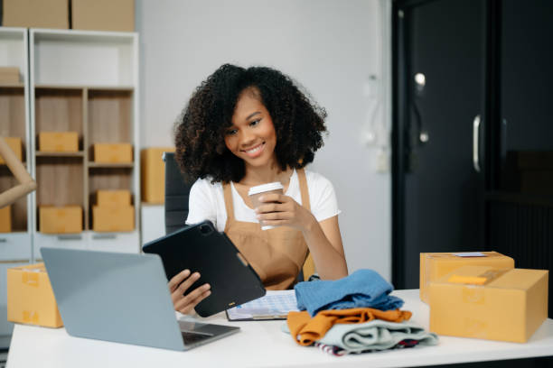istock Asian young woman SME working using smartphone or tablet taking receive and checking online purchase shopping order 2163711851