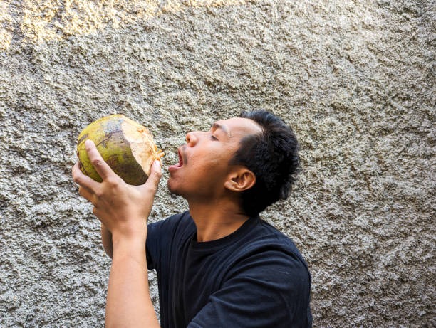 istock A Southeast asian man drinking coconut on the terrace 2163712326