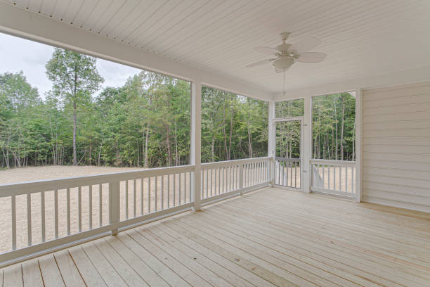 istock Spacious Screened Porch With Ceiling Fan Overlooking A Natural Landscape 2163712423