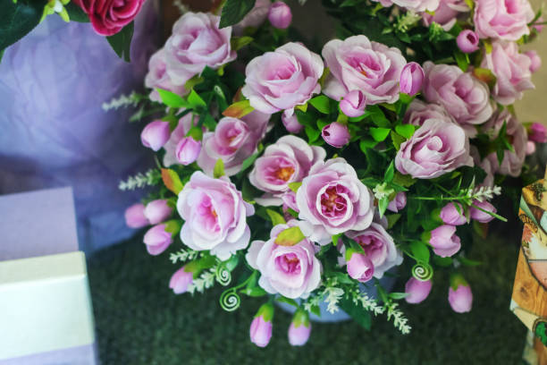 istock There are several pink roses arranged on a table, creating a beautiful display 2163717149