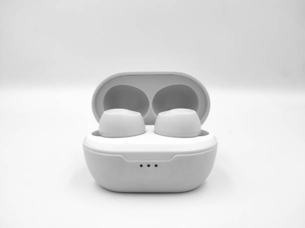 istock White wireless bluetooth earbuds close up photoshoot isolated on white background 2163721328