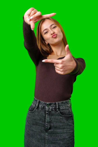 istock Young Woman Making A Framing Gesture With Her Fingers 2163724085