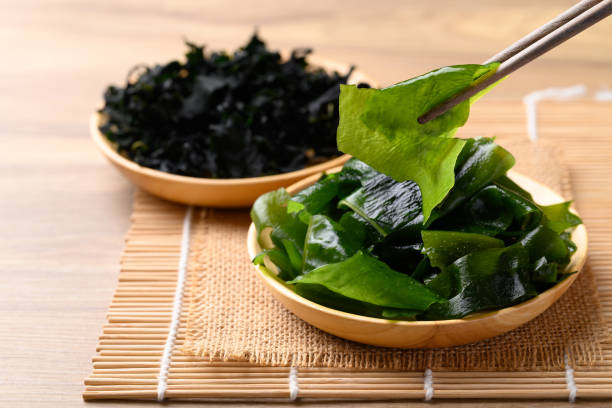 Fresh Wakame seaweed or sea mustard with chopsticks