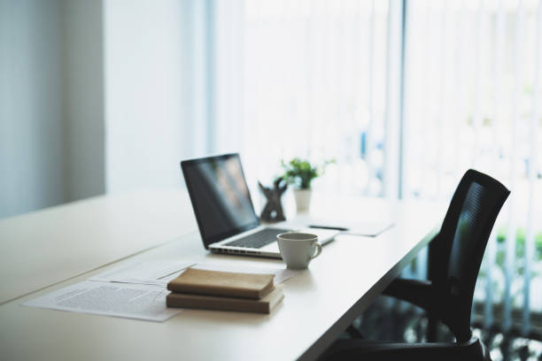 istock modern office interiors Workplace with laptop. business office background 2163730203