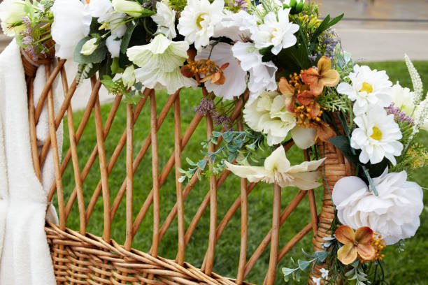 istock artificial flowers on rattan. Weaving from a vine. 2163732380