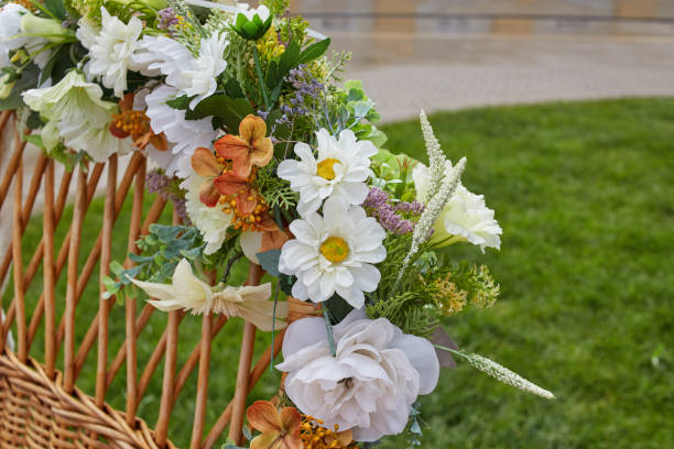 istock artificial flowers on rattan. Weaving from a vine. 2163732381