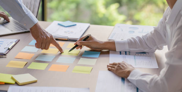 istock Business People brainstorming Meeting Design Ideas use post it notes to share idea professional investor start up project business brainstorming planning in office 2163734353