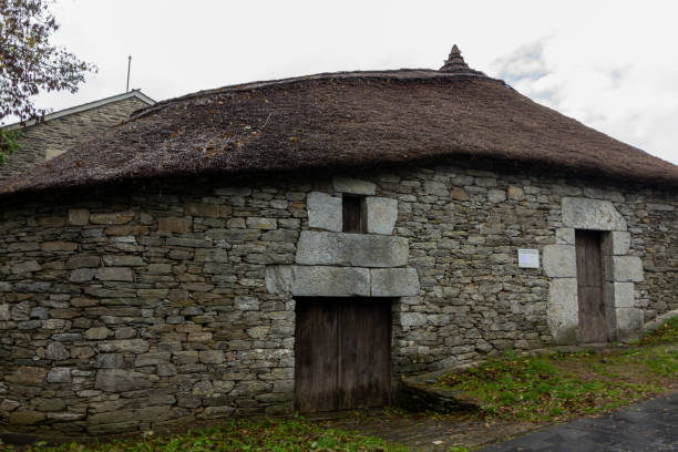 istock Rustic stone cottage with thatched roofs and traditional windows in a rural setting. Palloza, O Cebreiro, Spain 2163734533