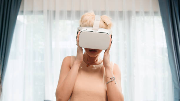 istock Gen z funny woman VR experience at home 2163735285