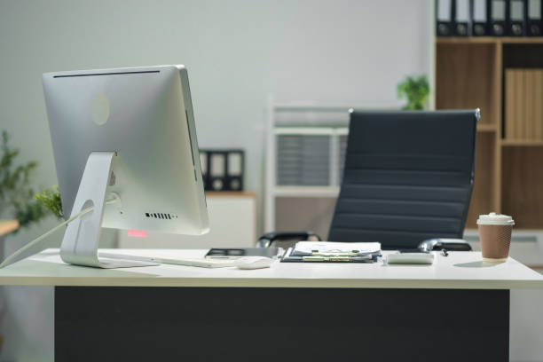 istock Workspace area with Mock up Blank screen computer desktop tablet smartphone and paperwork on the table in the office concept. 2163735612