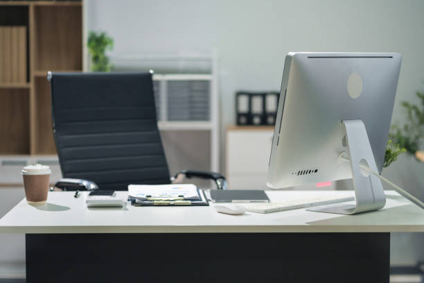 istock Workspace area with Mock up Blank screen computer desktop tablet smartphone and paperwork on the table in the office concept. 2163735627