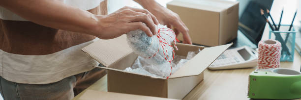 istock Business owner entrepreneur packing cardboard box preparing parcel for shipment, Online marketing. 2163739872