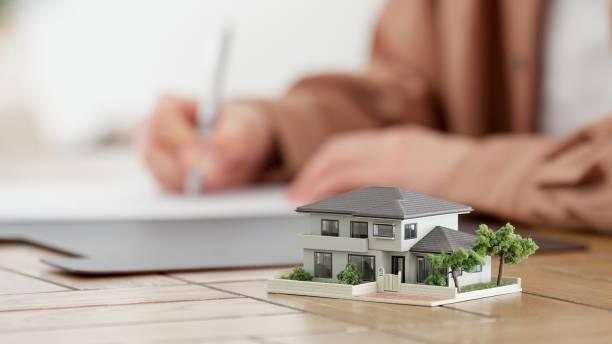 Hands of a man signing a real estate contract stock photo