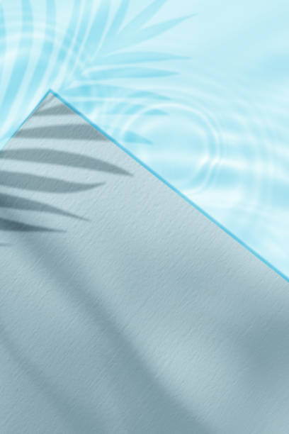 istock Summer Background, Blue Water Surface Texture Swimming Pool with Cement Floor with Light, Shadow Palm Leaves,Backdrop Podium Display and Poolside with sun reflection,Concept cosmetic or Spa Product 2163744045