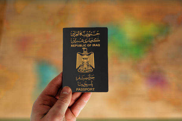 istock Iraq passport in man hand 2163745756