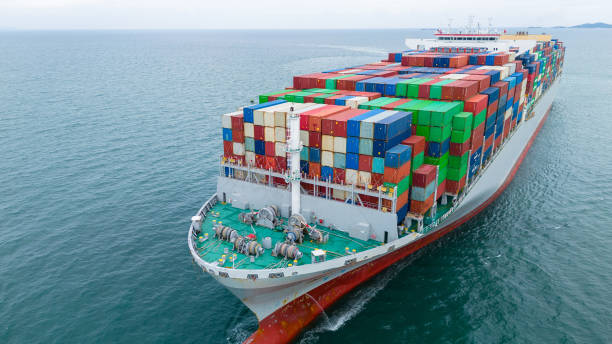 istock Front of Cargo container ship carrying container and running in international container port customs shipyard sea port concept smart logistic service. Container Ship. 2163749510