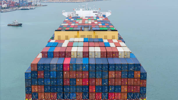 istock stern of Cargo container ship carrying container and running in international container port customs shipyard sea port concept smart logistic service. stern Container Ship. 2163749728