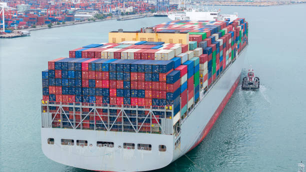 istock stern of Cargo container ship carrying container and running in international container port customs shipyard sea port concept smart logistic service. stern Container Ship. 2163749730