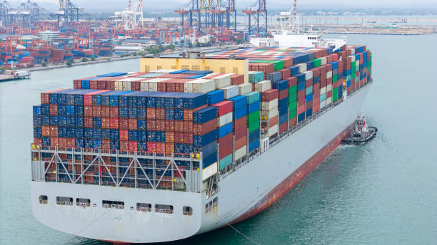 istock stern of Cargo container ship carrying container and running in international container port customs shipyard sea port concept smart logistic service. stern Container Ship. 2163749733