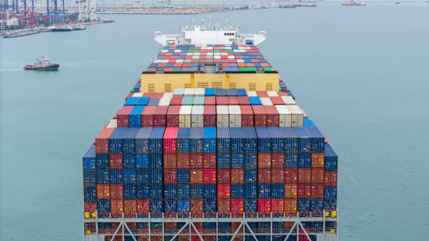 istock stern of Cargo container ship carrying container and running in international container port customs shipyard sea port concept smart logistic service. stern Container Ship. 2163749853
