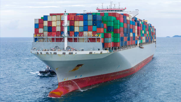 istock Front of Cargo container ship carrying container and running in international container port customs shipyard sea port concept smart logistic service. Container Ship. 2163749858
