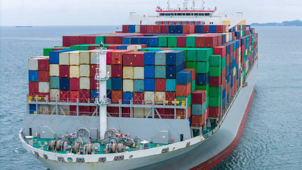 istock Front of Cargo container ship carrying container and running in international container port customs shipyard sea port concept smart logistic service. Container Ship. 2163749867