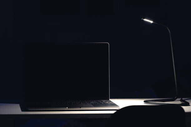 istock Black laptop screen in a dark room at night. 2163752141