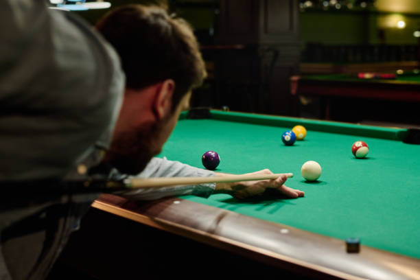 istock Pool player concentrating on white ball 2163752830