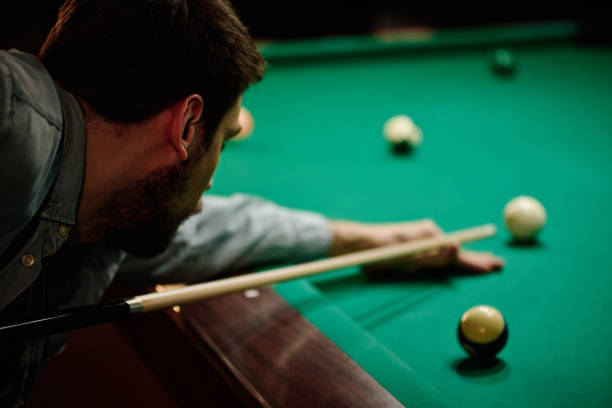 istock Young billiards player in casualwear 2163752859