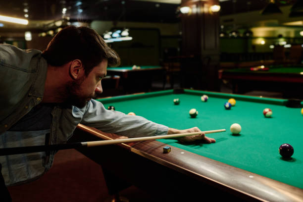 istock Bending over table with billiards balls 2163752869