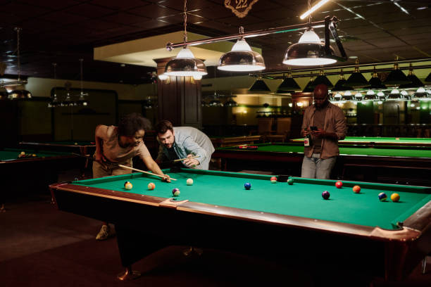 istock Man and woman playing billiards 2163752871