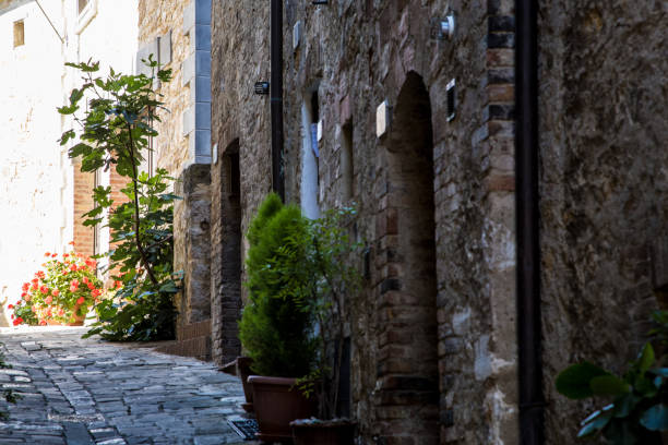 An old Italian street bathed in sunlight. Summer sunny day in an old Italian town.