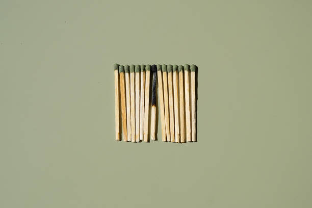 Three matches, one whole orange color. Concepts individuality.