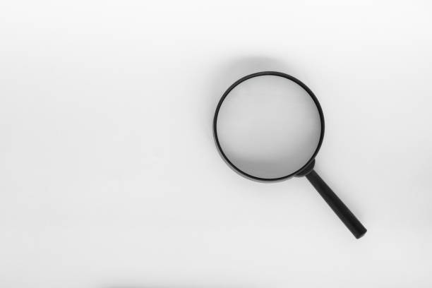 istock Magnifying Glass isolated on white color background 2163756427