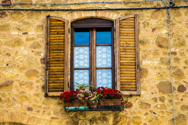 istock A box of flowers under an old shutter 2163758569