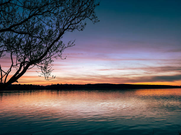 the twilight calm: A colorful sunset over a quiet lake