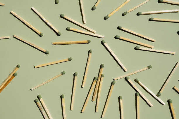 istock Wooden matchsticks scattered on a green background. 2163759802