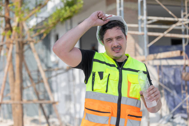 istock Hot Tired Thirsty Construction Worker Drinking Water on the Job Site 2163762641