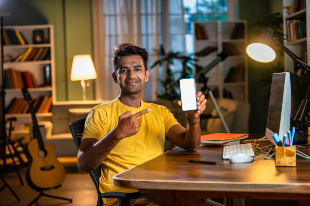 Indian asian male college student studying at home