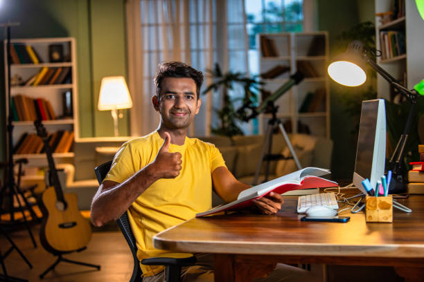 istock Indian asian male college student studying at home 2163762787