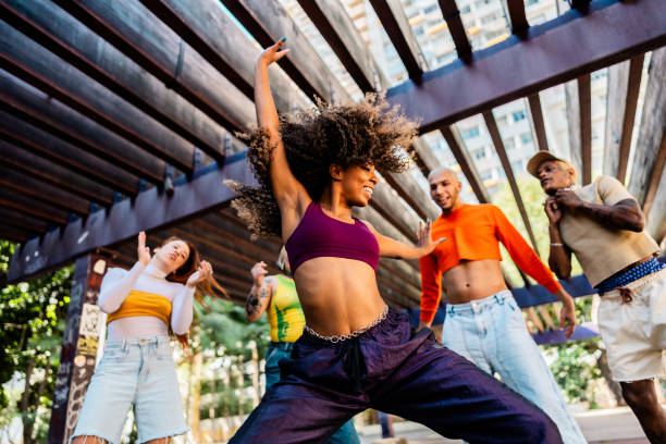 istock Young woman dancing outdoors 2163763148