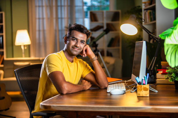 istock Indian asian male college student studying at home 2163763322