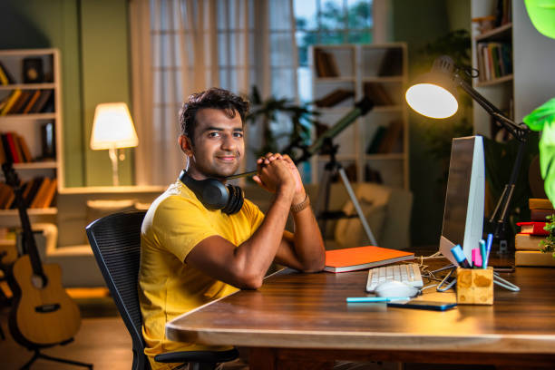 istock Indian asian male college student studying at home 2163763323