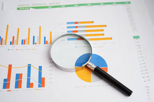 istock Magnifying glass on charts graphs paper. Financial development, Banking Account, Statistics, Investment Analytic research data economy. 2163763922