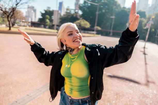 istock Young woman dancing outdoors 2163764172