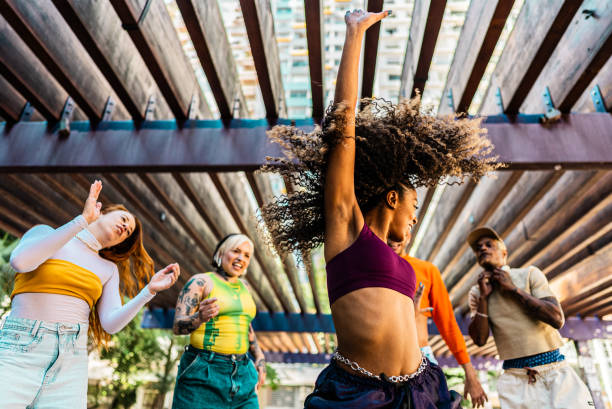 istock Young woman dancing outdoors 2163764626