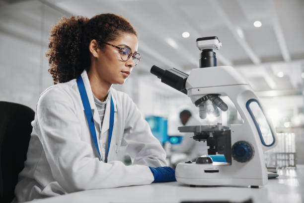 istock Science, woman and research with microscope in lab for investigation, development and bacteria test. Scientist, innovation and biotech with planning for stem cell study, exam or growth in vaccinology 2163767426